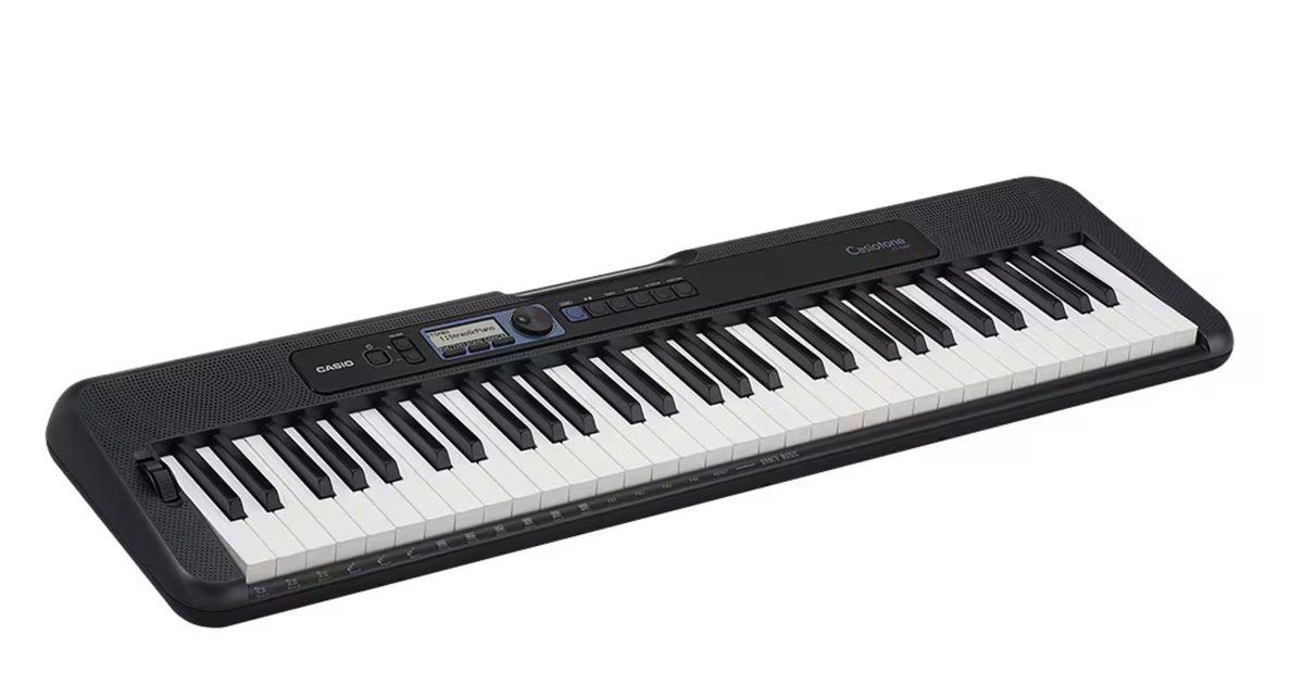 A small lightweight 61-key portable keyboard with a carrying handle built into the body, photographed on a plain background from a three quarter angle, compact and modern design
